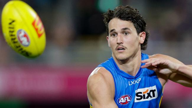 BRISBANE, AUSTRALIA - MAY 05: Wil Powell of the Suns and Charlie Cameron of the Lions in action during the 2024 AFL Round 08 match between the Brisbane Lions and the Gold Coast SUNS at The Gabba on May 05, 2024 in Brisbane, Australia. (Photo by Russell Freeman/AFL Photos via Getty Images)