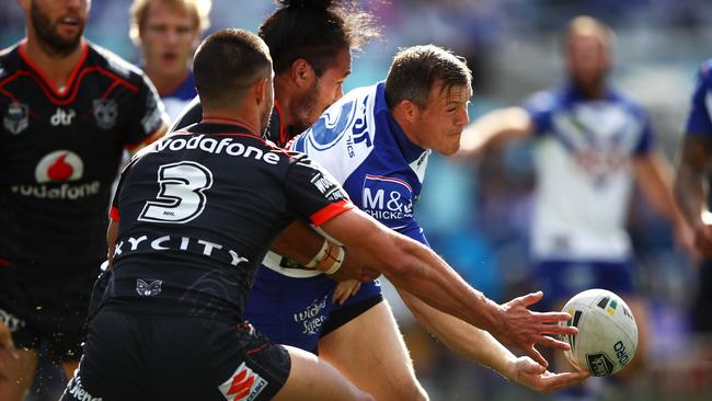 Brett Morris offloading in traffic. (Photo by Mark Kolbe/Getty Images)