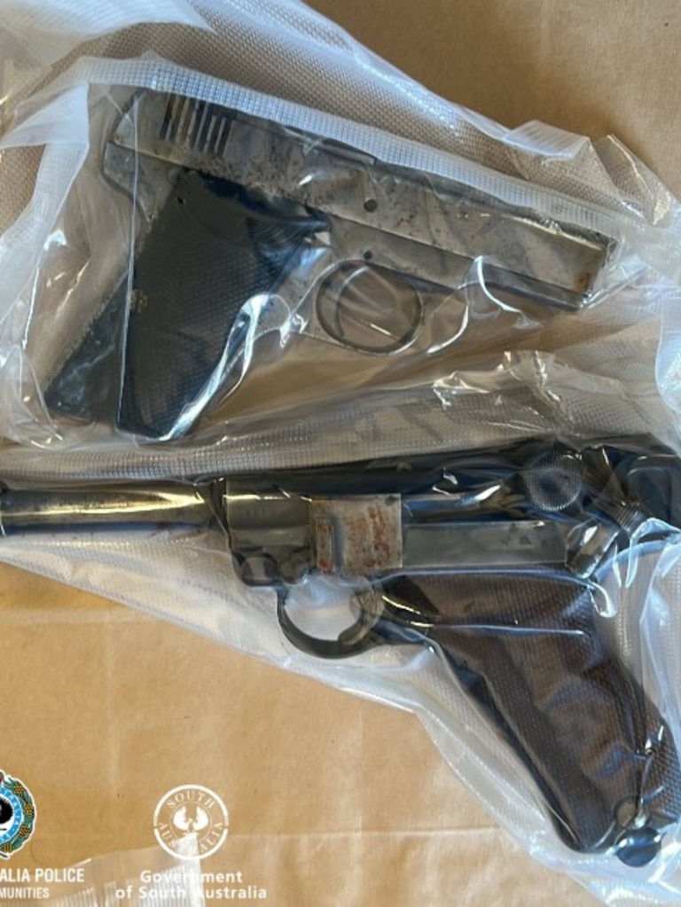 Three handguns were allegedly located on the property. Picture: South Australia Police