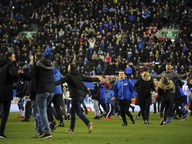 Wigan Athletic fans celebrate.