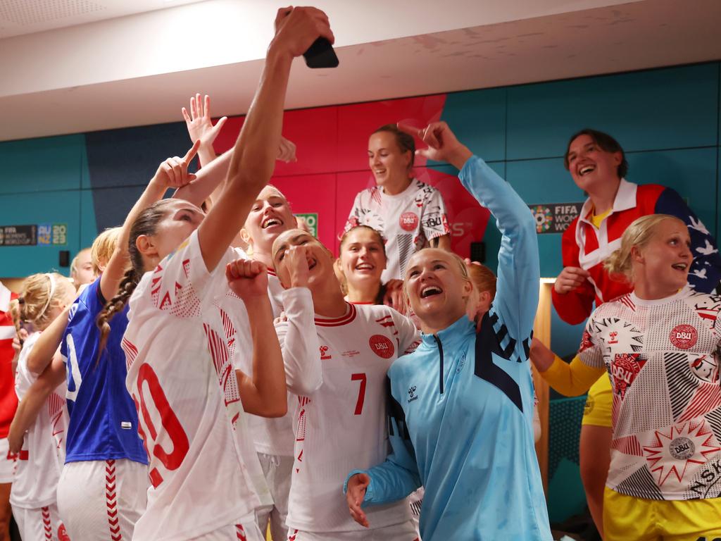 Signe Bruun, Sanne Troelsgaard and Pernille Harder of Denmark celebrate with teammates in the dressing room after their team advanced to the knockout stages of the Women's World. Picture: Alex Grimm/Getty Images