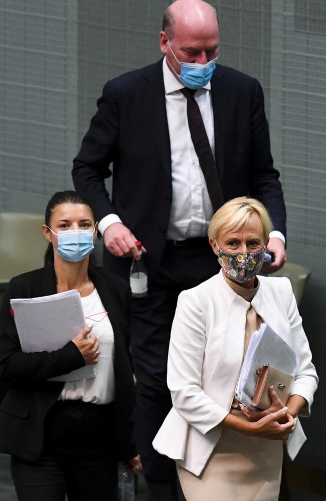 Liberal member for Higgins Katie Allen (right), Liberal member for North Sydney Trent Zimmerman (top) and Liberal member for Reid Fiona Martin (left) all crossed the floor to vote in favour of an amendment to enshrine the protection of trans kids in the religious discrimination bill, Thursday, February 10, 2022. (AAP Image/Lukas Coch) NO ARCHIVING