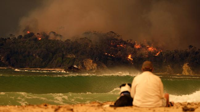 Locals seek refuge on the beach in NSW. Picture: Alex Coppel