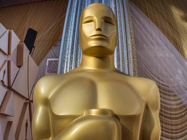 (FILES) In this file photo taken on February 08, 2020 an Oscars statue is displayed on the red carpet area on the eve of the 92nd Oscars ceremony at the Dolby Theatre in Hollywood, California. - The Oscars will have a host for the first time since 2018, broadcaster ABC said January 11, 2022, after television ratings for film's biggest night have plummeted in recent years. (Photo by Mark RALSTON / AFP)