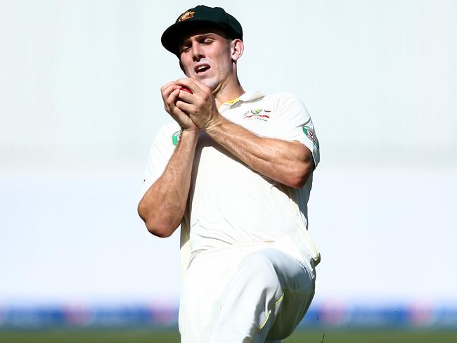 Mitch Marsh hangs onto a catch to dismiss Asad Shafiq.