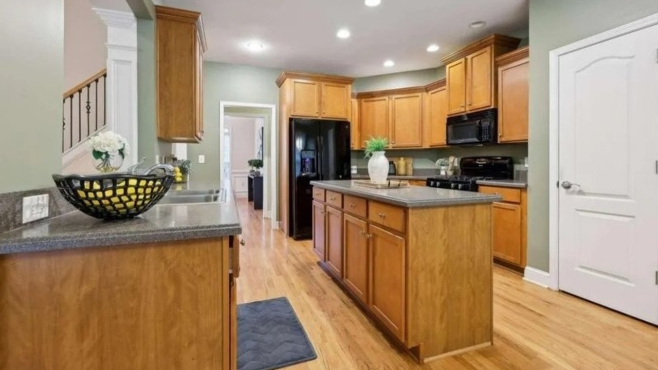 An oversized kitchen features an island and a pantry closet. Picture: Realtor