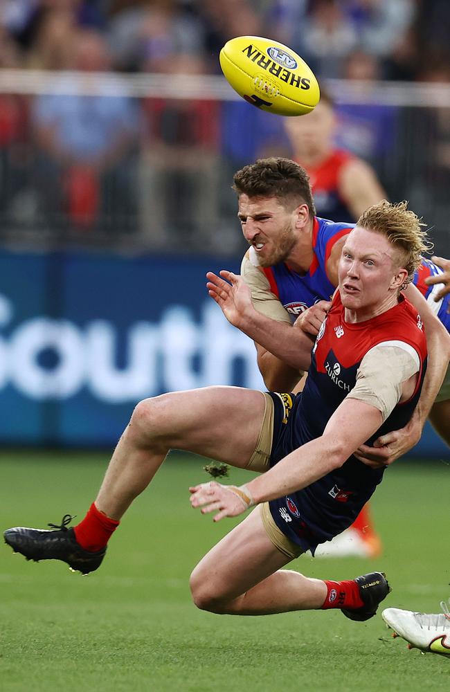 Clayton Oliver clears as he is tackled by Marcus Bontempelli. Picture: Michael Klein