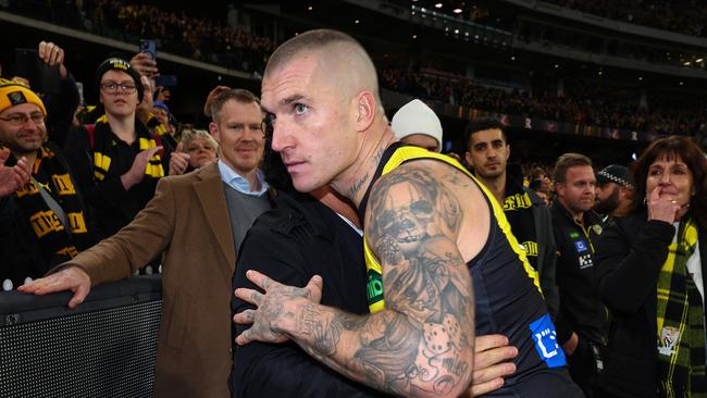 MELBOURNE, AUSTRALIA - JUNE 15: Dustin Martin of the Tigers embraces his agent Ralph Carr following his 300th match the round 14 AFL match between Richmond Tigers and Hawthorn Hawks at Melbourne Cricket Ground on June 15, 2024 in Melbourne, Australia. (Photo by Graham Denholm/Getty Images)