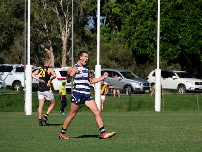 Broadbeach Cats forward Jordan Moncrieff celebrates after kicking a goal against Labrador Tigers. Photo: Brooke Sleep Photography.