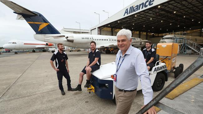 Alliance Airlines’ managing director Scott McMillan some of his aircraft engineers at their base in Brisbane Airport. Picture: Lyndon Mechielsen