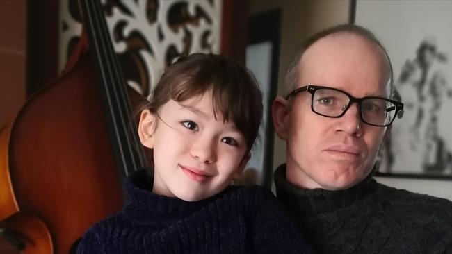 Australian Simon Carter and daughter Imogen in their flat in Wuhan, China. Supplied