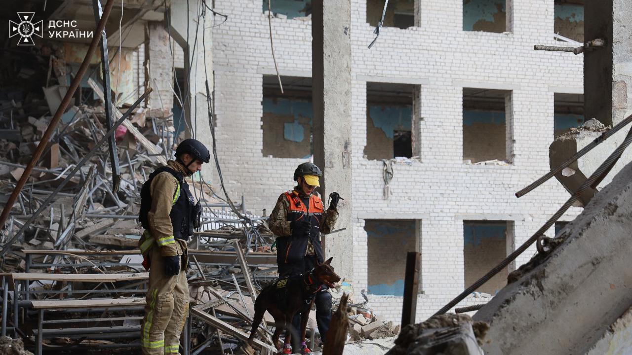 Ukrainian rescuers working in the military communications institute in Poltava. Picture: AFP.