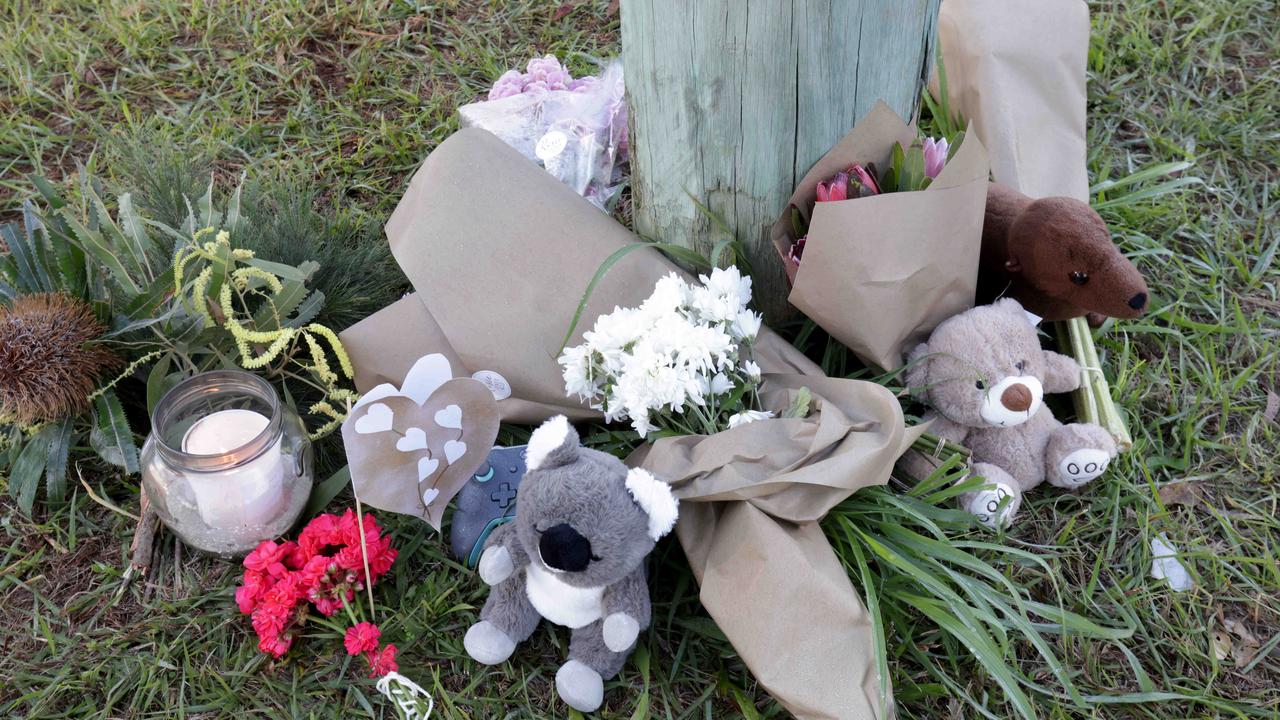 Flowers near the scene, as police and emergency services investigate the fatal fire on Russell Island. Photo Steve Pohlner