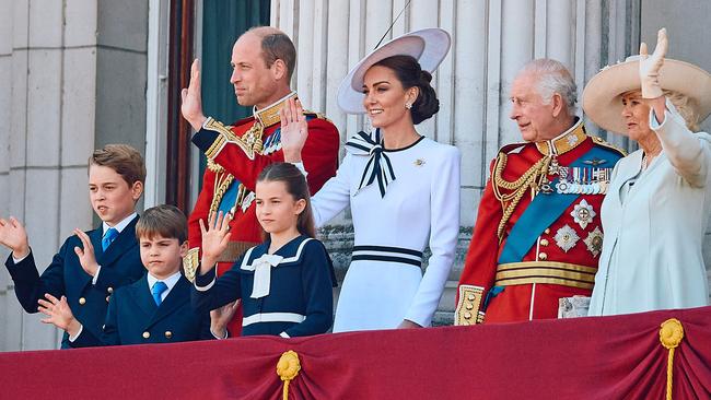 TOPSHOT - (L-R) Britain's Prince George of Wales, Britain's Prince William, Prince of Wales, Britain's Prince Louis of Wales, Britain's Princess Charlotte of Wales, Britain's Catherine, Princess of Wales, Britain's King Charles III and Britain's Queen Camilla wave on the balcony of Buckingham Palace after attending the King's Birthday Parade "Trooping the Colour" in London on June 15, 2024. The ceremony of Trooping the Colour is believed to have first been performed during the reign of King Charles II. Since 1748, the Trooping of the Colour has marked the official birthday of the British Sovereign. Over 1500 parading soldiers and almost 300 horses take part in the event. (Photo by BENJAMIN CREMEL / AFP)