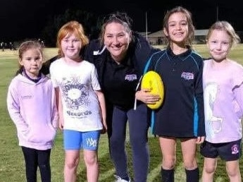 Cristelle Mulvogue, middle, with some of the club's Auskick kids.