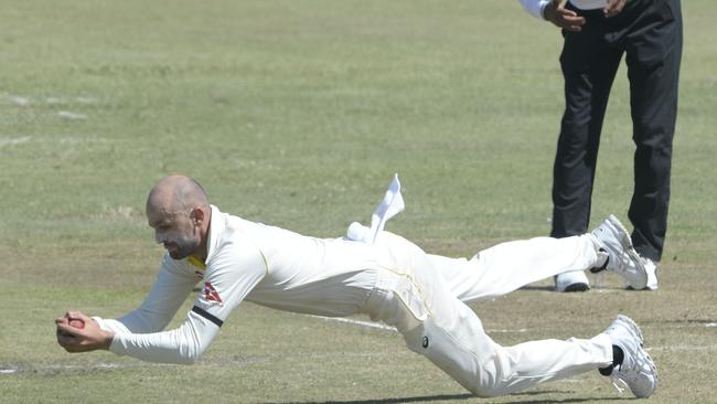 DURBAN, SOUTH AFRICA - MARCH 02: Nathan Lyon of Australia takes the catch for the wicket of Dean Elgar of the Proteas during day 2 of the 1st Sunfoil Test match between South Africa and Australia at Sahara Stadium Kingsmead on March 02, 2018 in Durban, South Africa. (Photo by Lee Warren/Gallo Images/Getty Images)