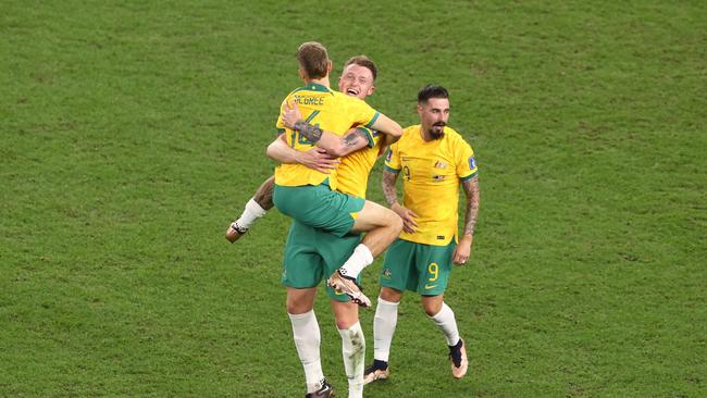 Joel King, Harry Souttar and Jamie Maclaren celebrate the win against Denmark. Picture: Robert Cianflone/Getty Images