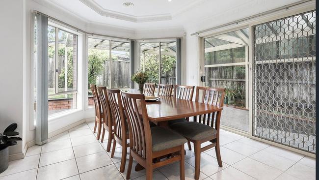 The home has indoor and outdoor entertaining areas, high ceilings and large windows.