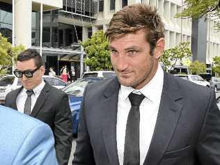 TRYING TIMES: Former Gold Coast Titan Dave Taylor leaves the Southport Magistrates Court yesterday after being committed to stand trial. Picture: DAN PELEDAAP