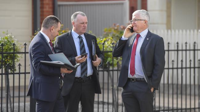 Detective Superintendent Des Bray (right) with police colleagues at the scene of the Woodville Gardens fire. Picture: RoyVPhotography