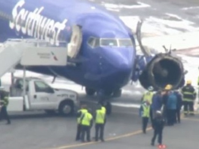 Emergency crews inspecting the doomed flight.