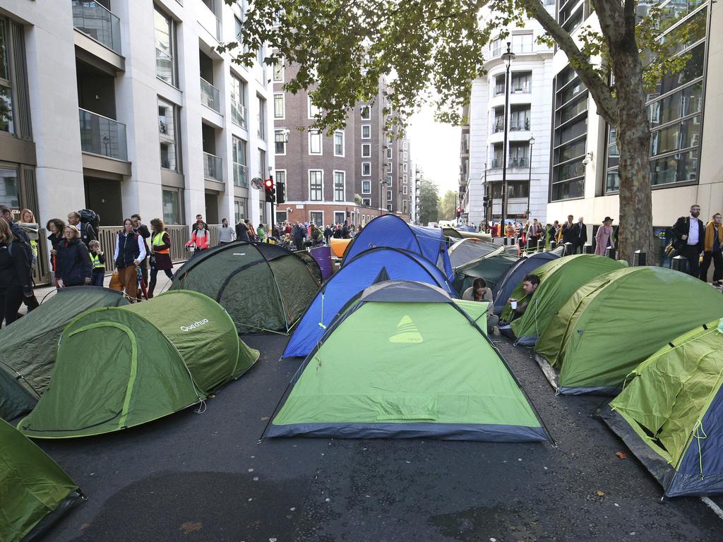 XR protesters take up residence in a London Street. Picture: Jonathan Brady/PA via AP