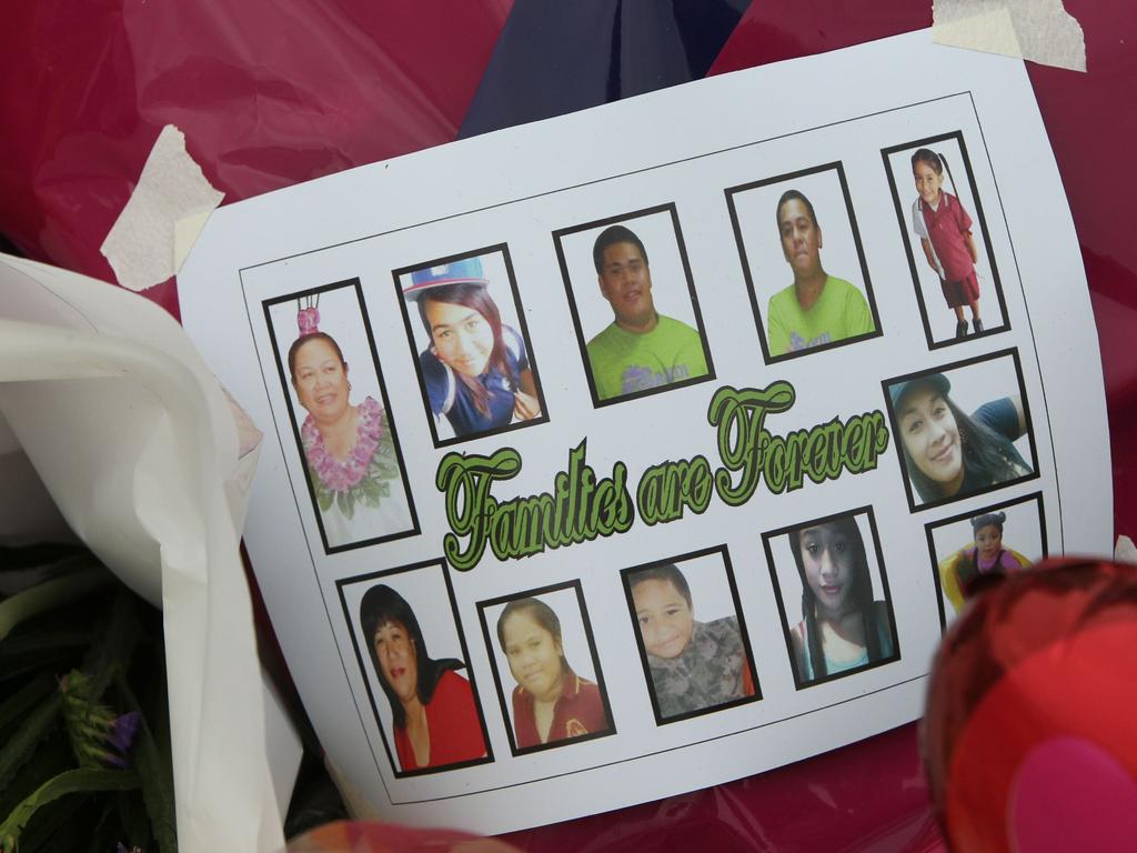 Flowers and tributes at the scene of the house fire, Wagensveldt Street, Slacks Creek, where 11 members of the family of Mele Lineti Sanipepa Cross died in 2011.