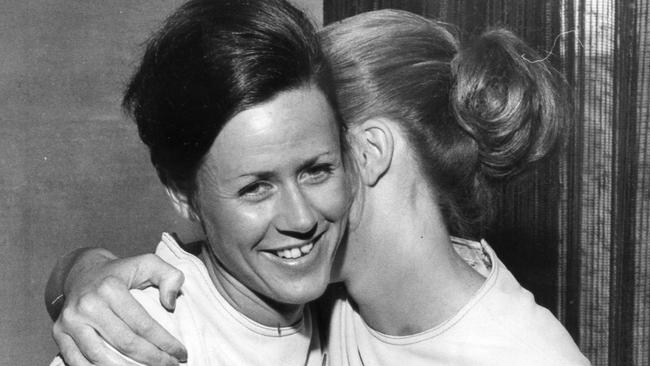 Safe home in Adelaide: hijack flight hostesses Kaye Goreham, left, and Gai Rennie hug each other in Ansett's airport VIP lounge on November 16, 1972. Picture: News Corp Australia