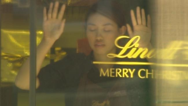 Elly Chen was one of several hostages forced to stand in a Lindt cafe window during the siege. Picture: Seven News.