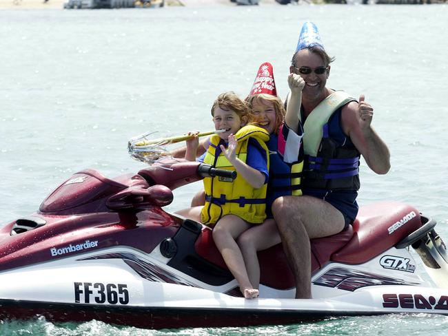 Lance Johnson with daughters Brittany, 6 (front) and Leah, 10 (centre) has been travelling to Sorrento for 15 years to celebrate New Yea'rs Eve. Picture: Jessica Lee