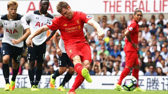 James Milner of Liverpool scores his side’s first goal.
