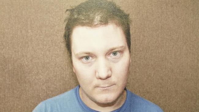 Chris Malyschko as photographed by police shortly after his arrest in October 2011 (photo copied from Brief of Evidence).