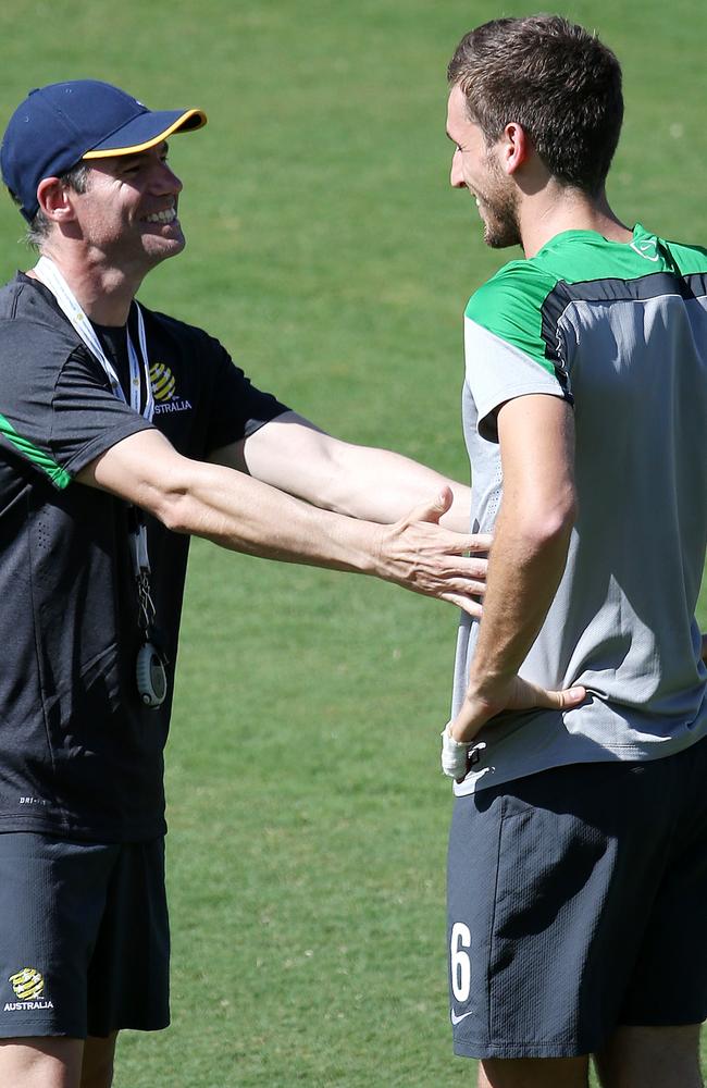 Assistant coach Ante Milicic has a laugh with Matthew Spiranovic during training. The pair previously worked together at Western Sydney Wanderers. Pic: George Salpigtidis.