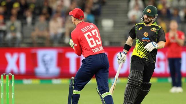 Matthew Wade (R) and Jos Buttler (L) during the warm-up game. Picture: Trevor Collens/AFP