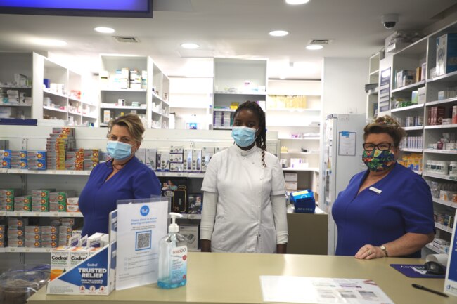 Julie Powell, local pharmacist Musa and Tracey Geddes are working to keep residents safe.