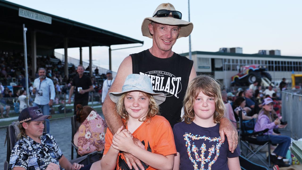 Hunter Humphries, 11, Andrew Humphries and Levi Humphries, 8, attend the 2024 Cairns Bull Throttle event, a bikes and bulls show, featuring bull riding and freestyle motorcross ridiers at the Cairns Showgrounds. Picture: Brendan Radke