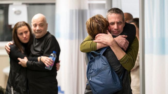 Fernando Simon Marman, right, is reunited with family in this photo released by the Israeli army. Picture: AF{ Photo / Handout / Israeli Army