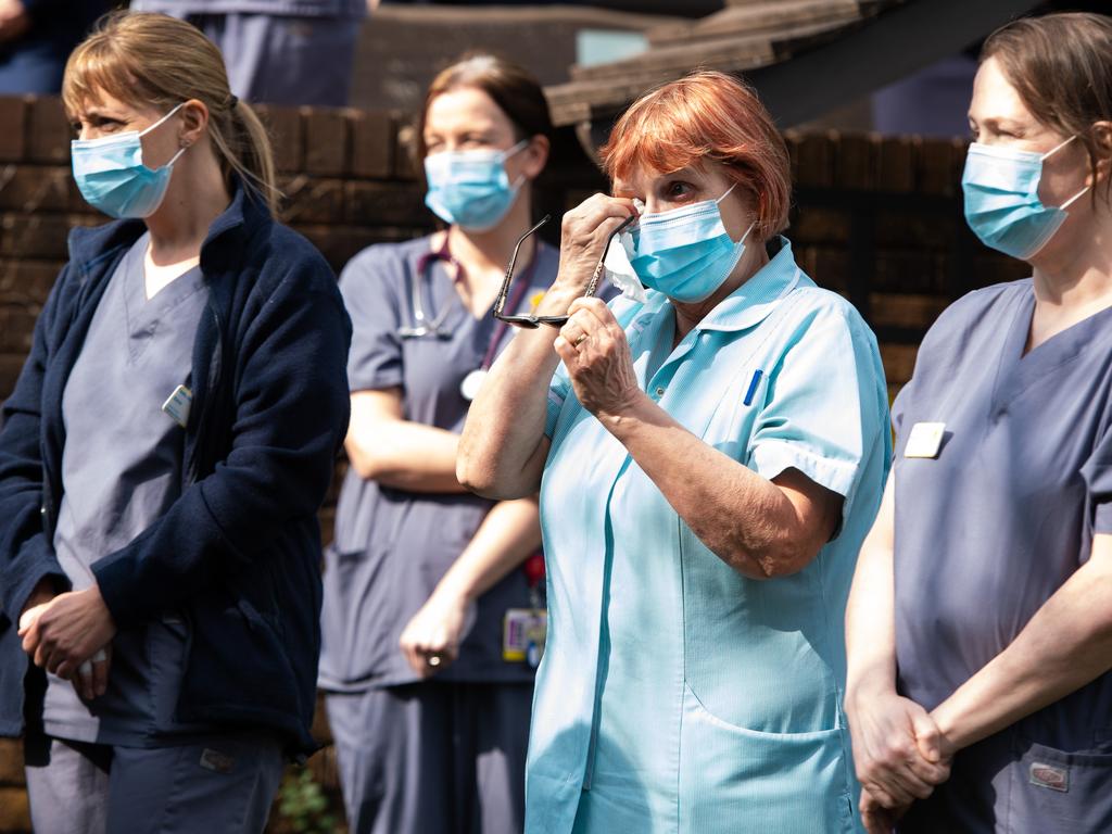 Staff of a Marie Curie hospice in Penarth, Wales, pay their respects to more than 126,000 dead in the UK. Picture: Polly Thomas/Getty Images