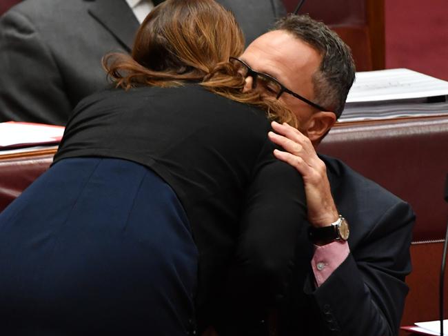 Greens Senator Sarah Hanson-Young hugs Greens leader Senator Richard Di Natale after he made a statement about behaviour and language today. Picture: AAP/Mick Tsikas