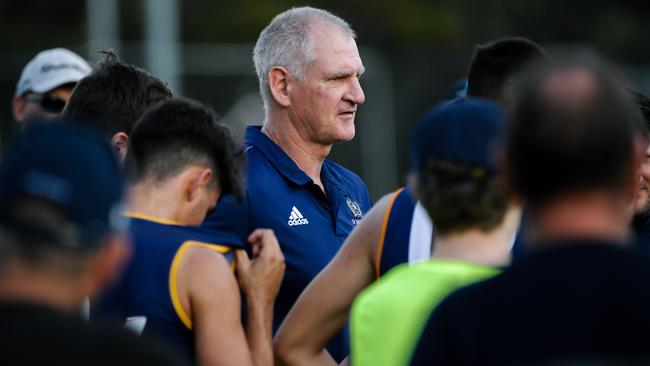 Mark Mickan in the quarter-time huddle with St Michael’s players on Saturday. Picture: Morgan Sette / AAP