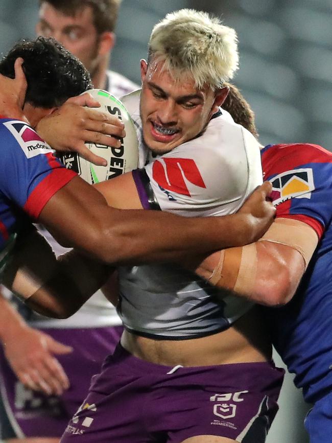 Storm’s Tino Faasuamaleaui is a handful for the Newcastle Knights defence. (Photo by Matt King/Getty Images)