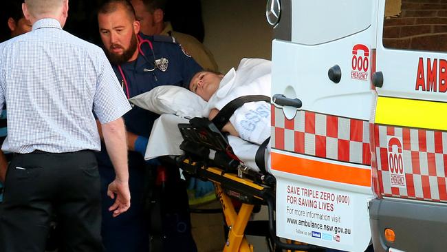 NSW Ambulance officers treat Ms Jay for multiple stab wounds in Magnolia Place, Port Macquarie. Picture: Nathan Edwards