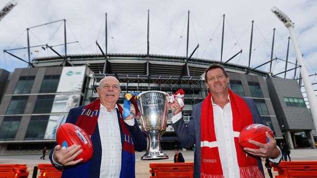 Premiership cup presenters Leigh Matthews (Brisbane Lions) and Stuart Maxfield (Sydney Swans). Picture: Dylan Burns