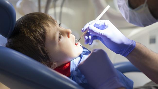 Primary-aged children will receive basic dental care including cleaning, fissure sealing, fillings and fluoride protection for free. Picture: iStock