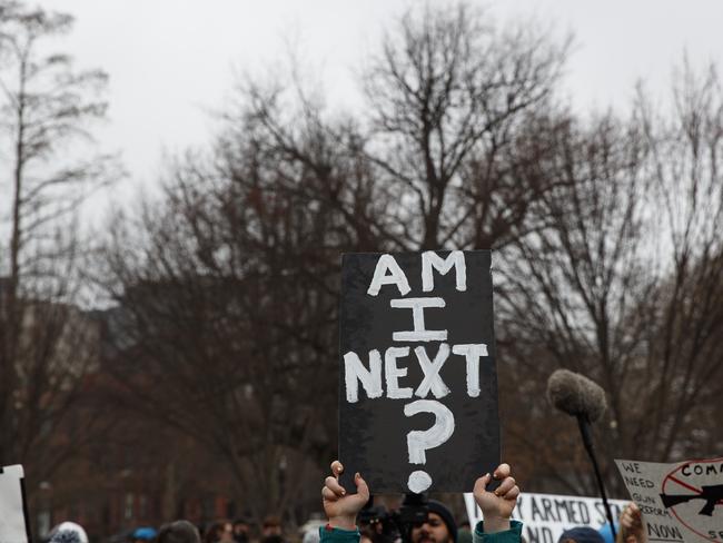 Demonstrators hold signs during a protest in favour of gun control reform in front of the White House. Picture: AP/Evan Vucci