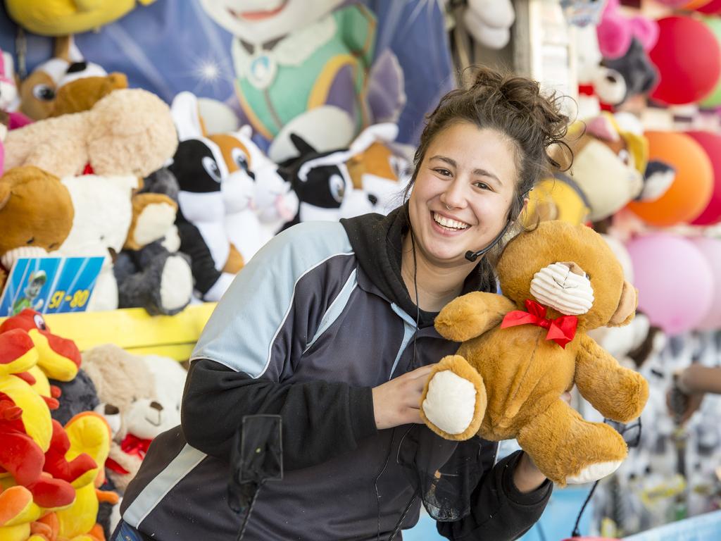 PENRITH PRESS/AAP. Cheynes Amusements staffer Cecilia Sannazzari shows off sideshow prizes on offer at the Penrith Show at Penrith on Saturday, August 24. The 2019 Penrith Show was held at Penrith Paceway over the weekend. (AAP IMAGE / Troy Snook)