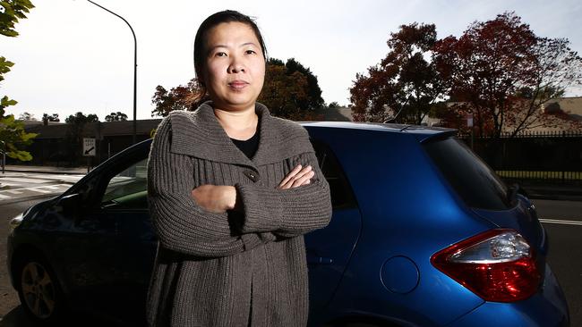 Lien Pham with her car which received three parking fines in one day / Picture: Tim Hunter