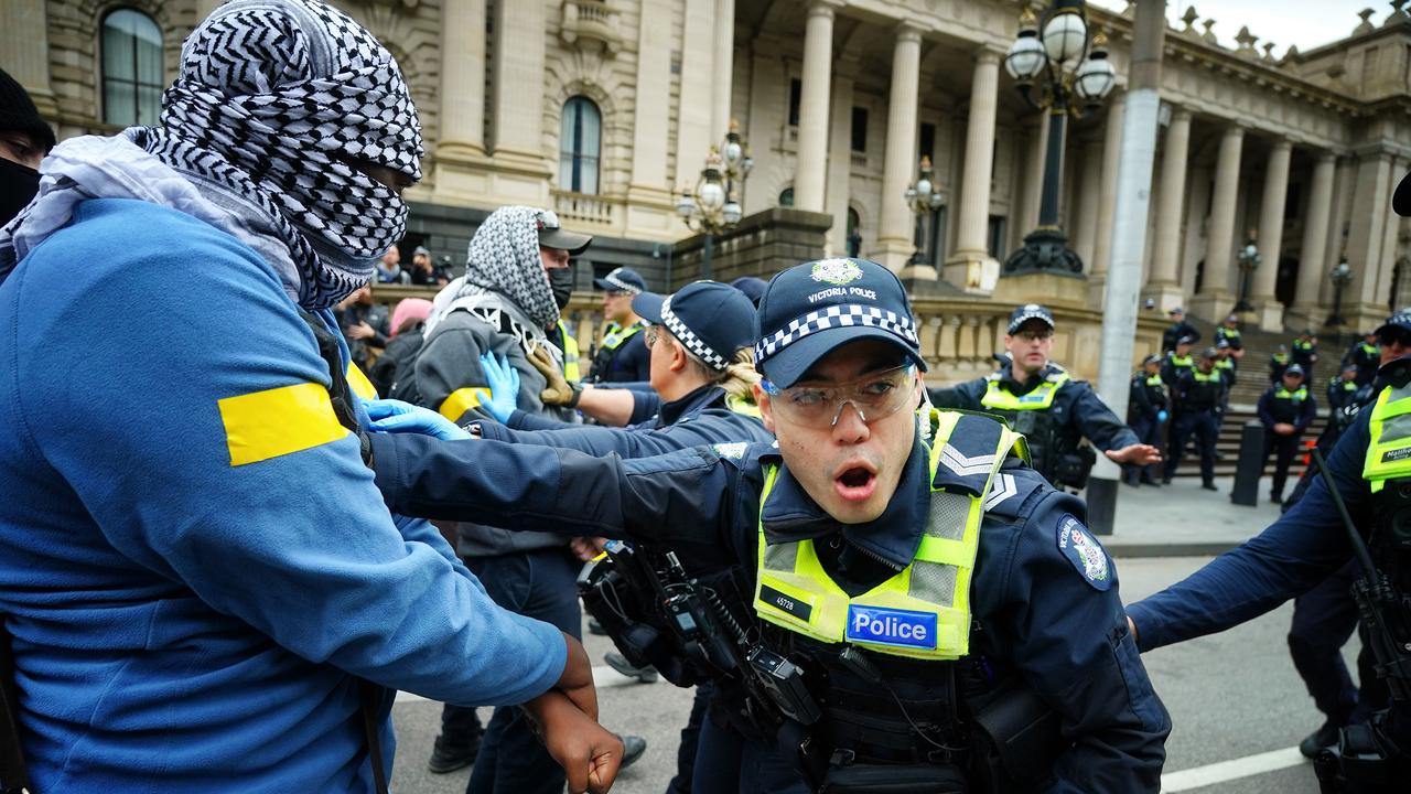 Pro-Palestinian protesters faced off with police outside the Victorian parliament. Picture: NCA NewsWire / Luis Enrique Ascui