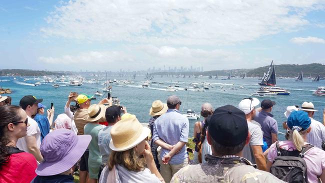 Spectators watch the start of the Sydney to Hobart yacht at Hornby Lighthouse near Watsons Bay on Boxing Day. Picture: NCA NewsWire/Thomas Parrish