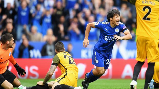 Shinji Okazaki of Leicester City scores past Mat Ryan in the Premier League.